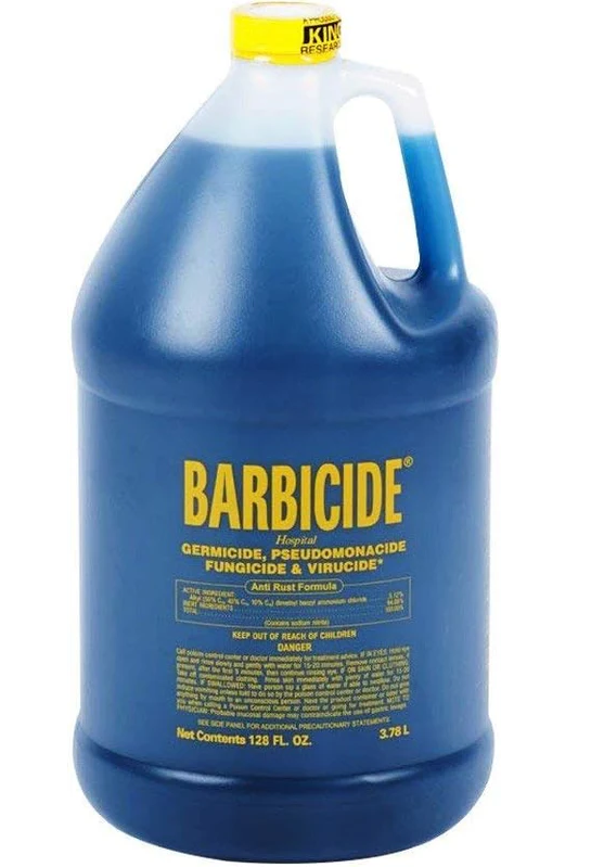 Barbicide bottle with blue liquid and yellow label on a white background