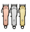 Three hair clippers in rose gold, silver, and gold on a white background
