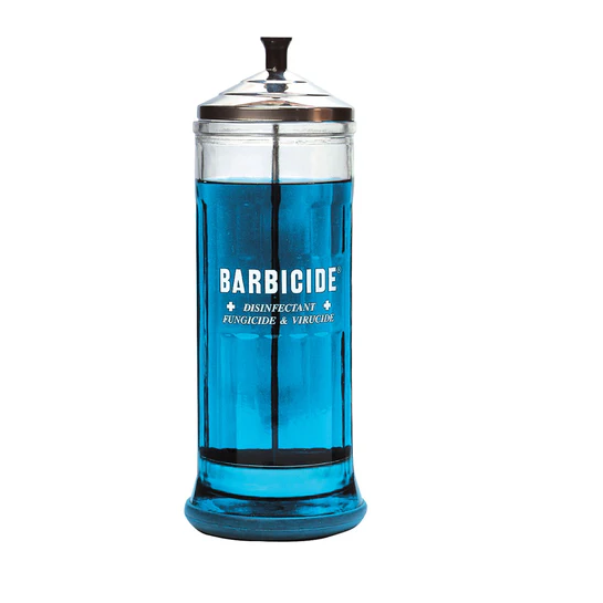 Clear jar  with 'Barbicide' label on a white background
