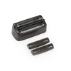 Black electric shaver head with three additional parts on a white background