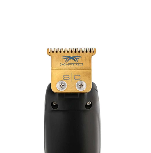 Hair trimmer with gold head and black handle on a white background