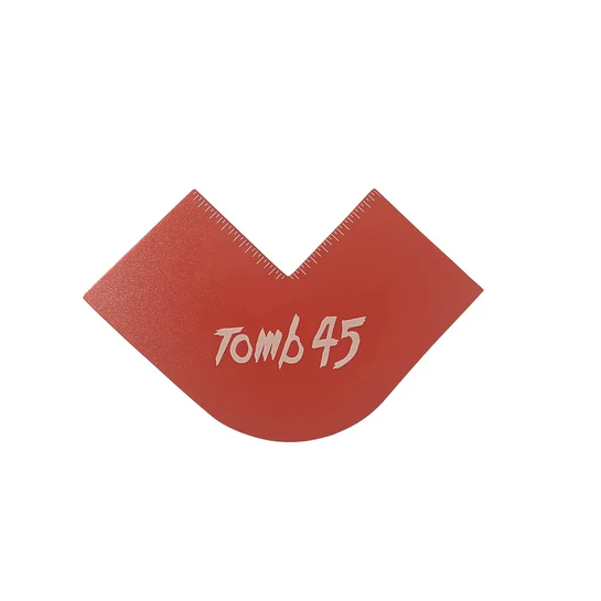 Red plastic tool with 'Tomb45' branding on a white background