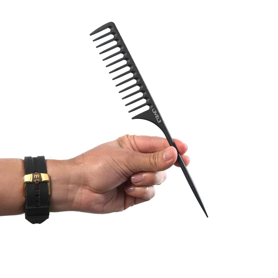 Hand holding a black comb against a white background
