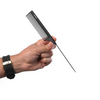 Hand holding a black comb on a white background