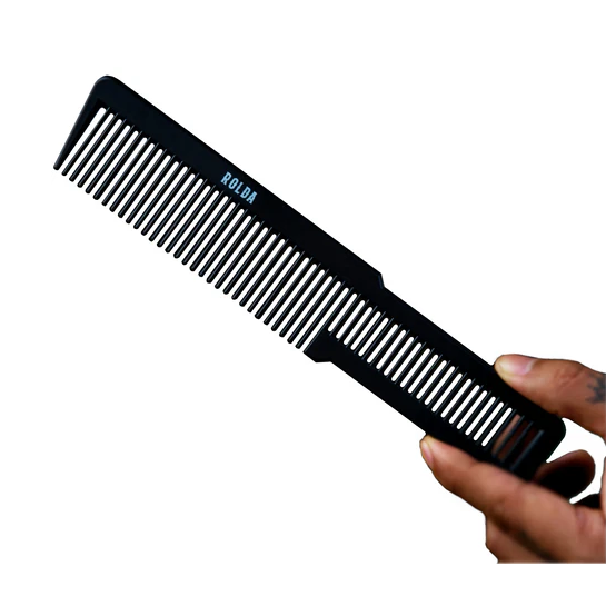 Black comb held by a hand on a white background