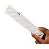 White comb held by a hand on a white background