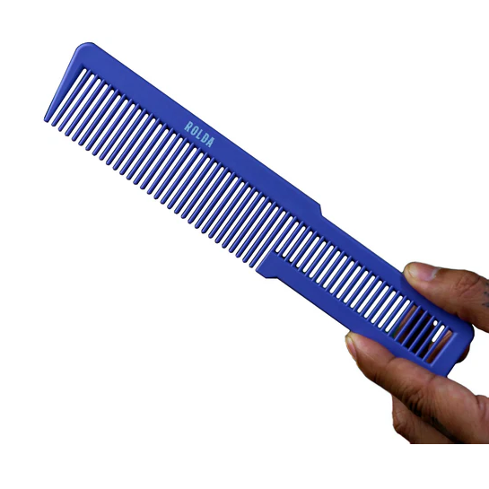 Blue comb held by a hand on a white background