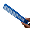 Blue comb held by a hand on a white background