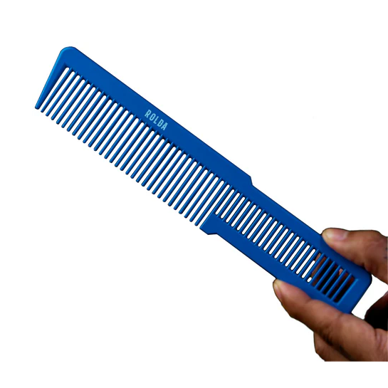 Blue comb held by a hand on a white background