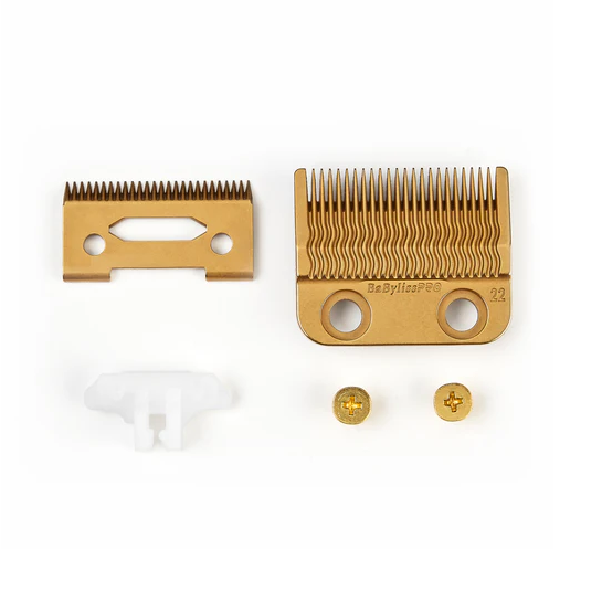 Gold grooming comb and attachments on a white background