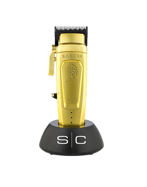 Gold hair clipper with black base on a white background