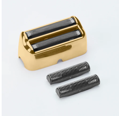 Gold electric shaver head with two black replacement heads on a light gray background
