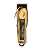Gold and black Wahl hair clipper on a white background