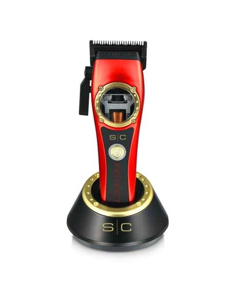 Red and black hair clipper with gold accents on a white background