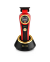 Red and black hair trimmer with gold accents on a white background