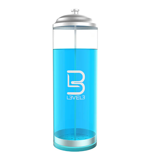 Blue glass bottle with silver cap on a white background