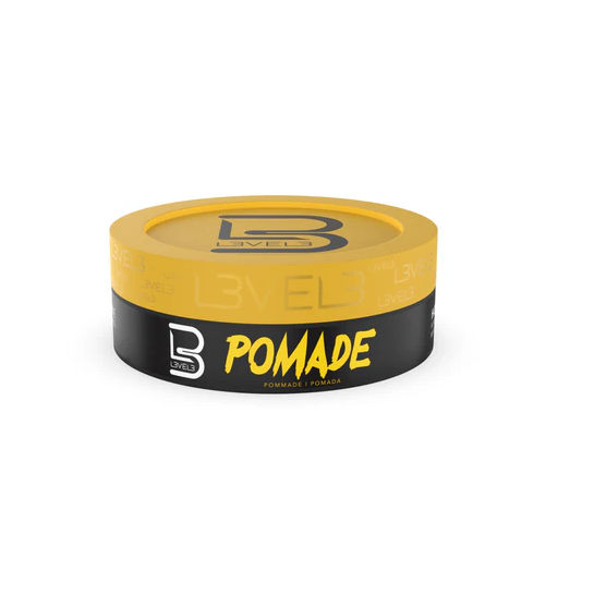 Yellow and black container of L3VEL3 pomade on a white background