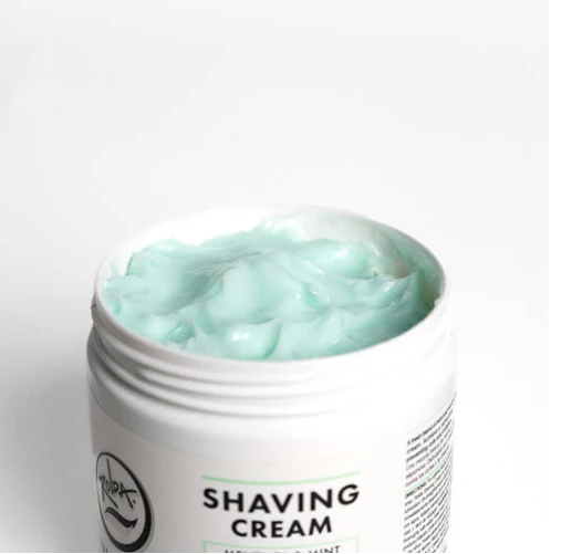 Jar of Rolda shaving cream with a white background