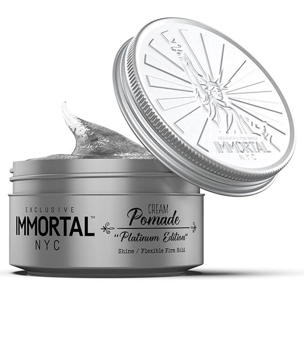 Immortal NYC Cream Pomade jar with open lid on a white background