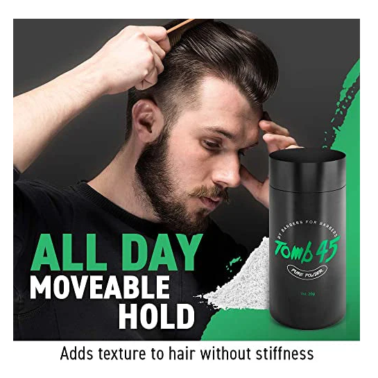 Person styling hair with a product container labeled 'Tomb 45' on a black background.
