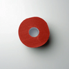 Red roll of 'L3VEL3' neck strips on a light gray background