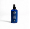 Blue bottle of aftershave cologne on a white background