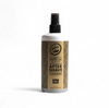 Bottle of after-shave cologne with a gold label on a white background