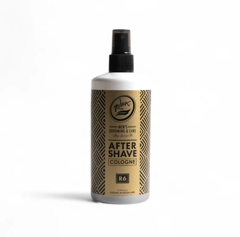 Bottle of after-shave cologne with a gold label on a white background