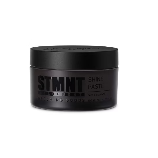 Black jar of STMNT Shine Paste on a white background