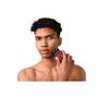 Man holding a red and black hair trimmer on a white background