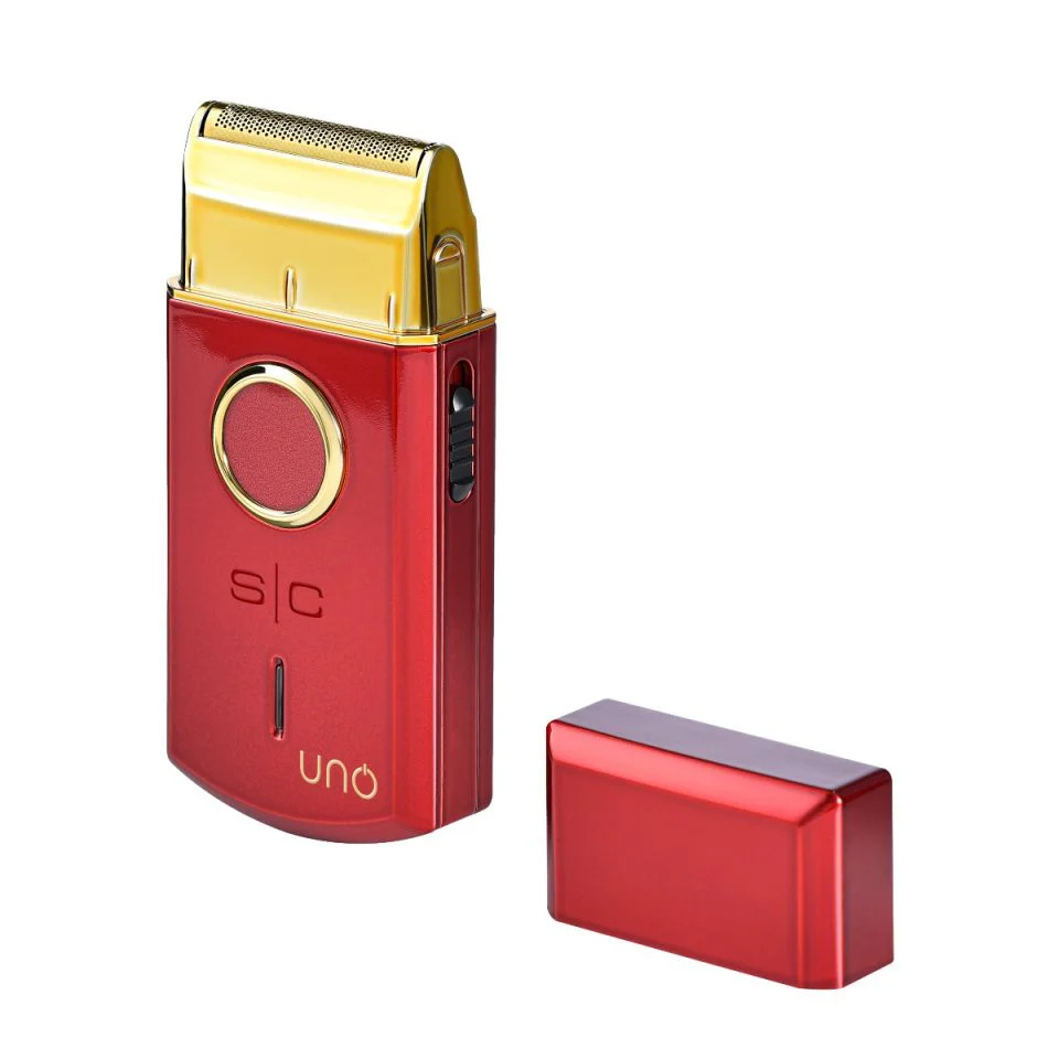 Red and gold shaver with packaging on a white background