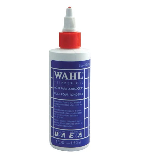 Wahl clipper oil bottle with blue label and red cap on a white background