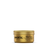 Gold jar of Immortal NYC hair wax on a white background